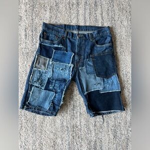 Blue and navy patchwork jorts with some distressed accents.